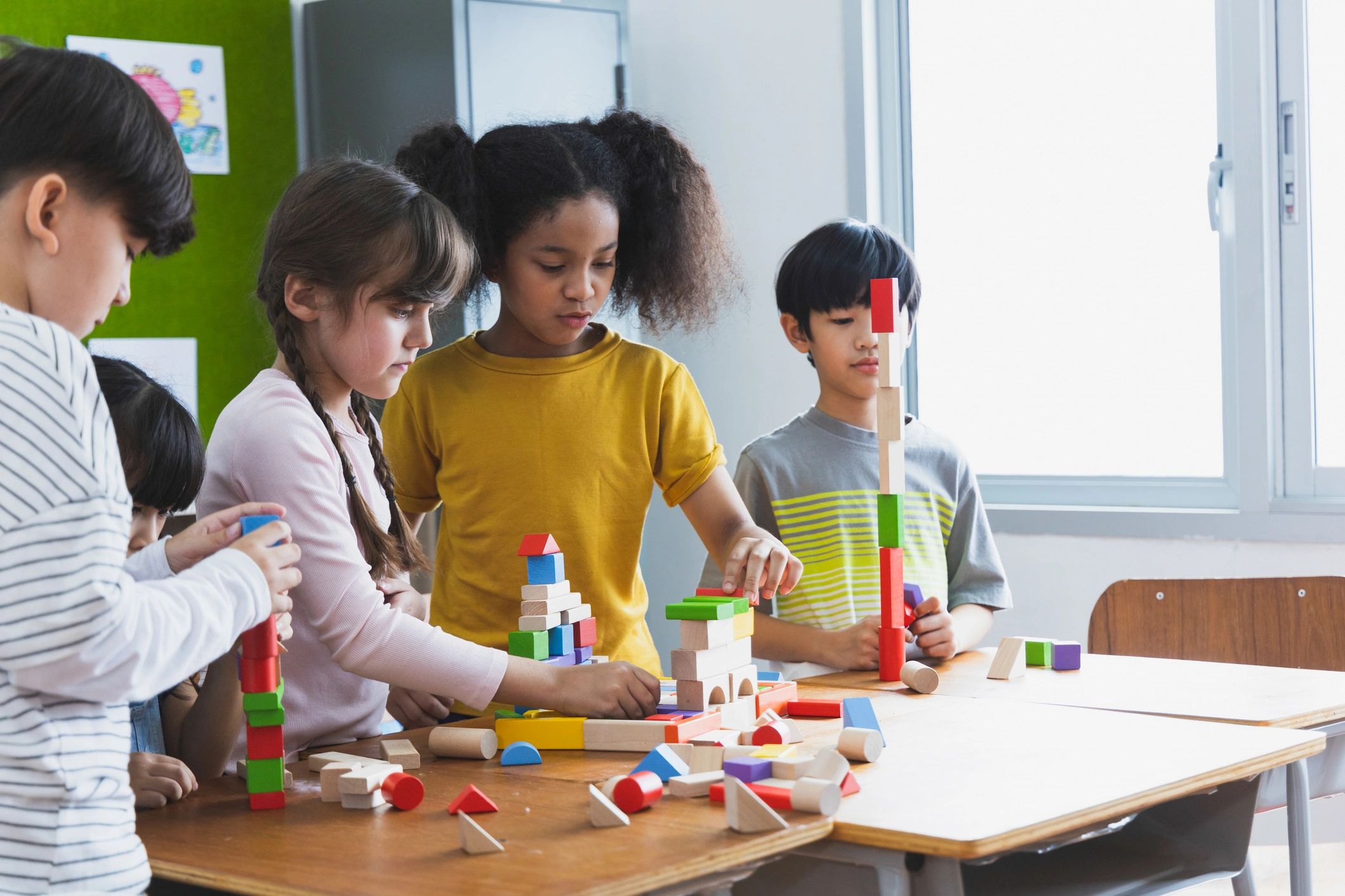 Children building together in a classroom