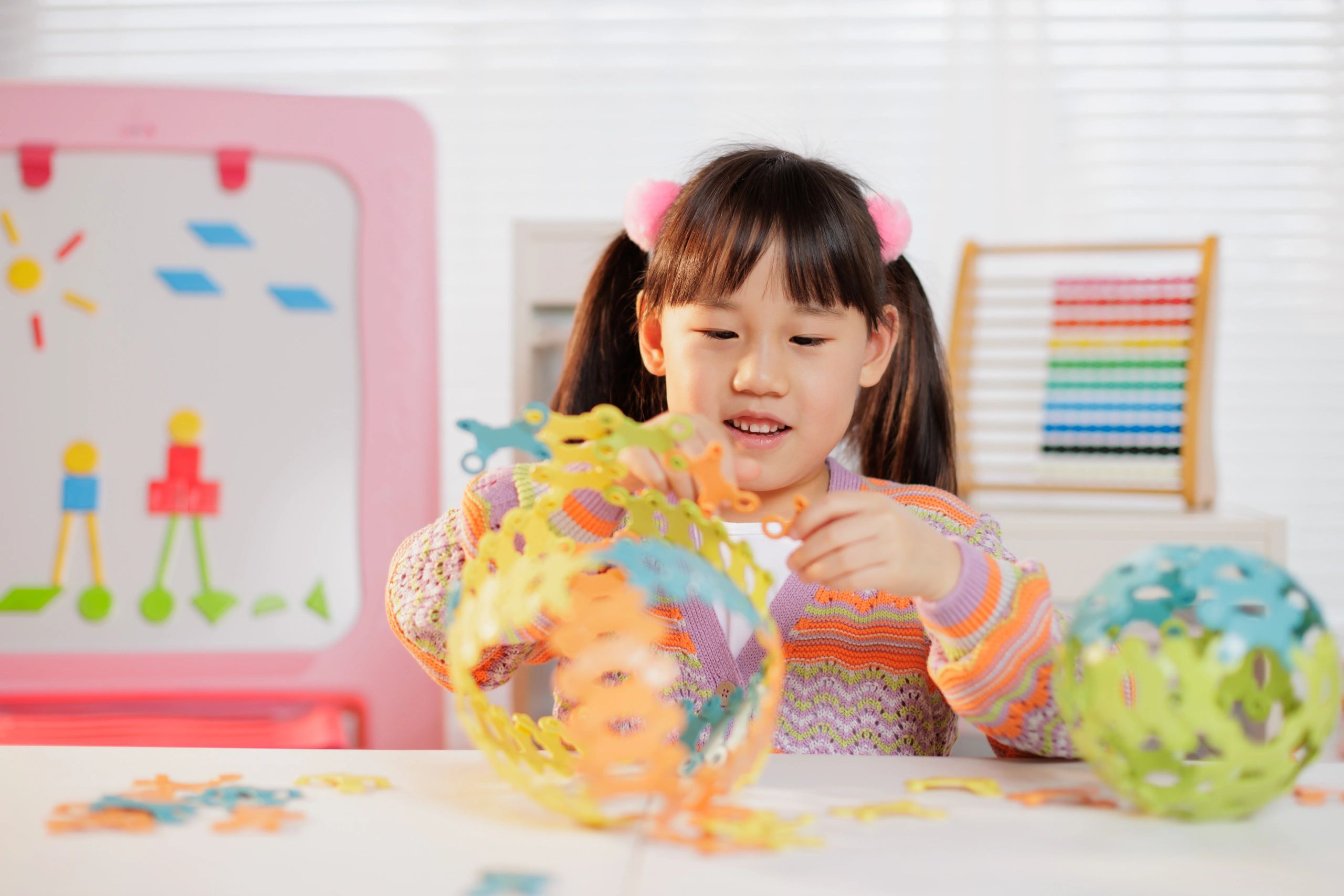 Young girl making a craft project at home