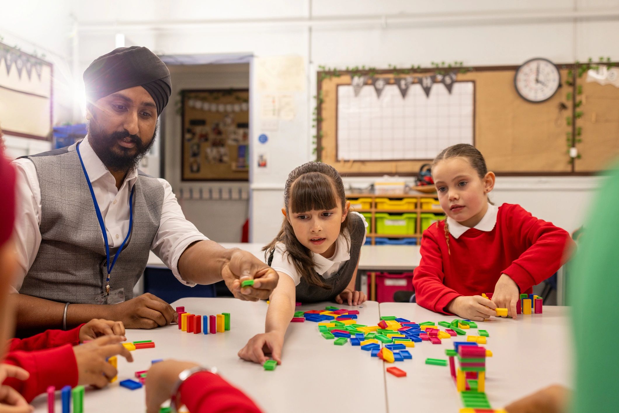 Teacher guiding students during an interactive classroom activity