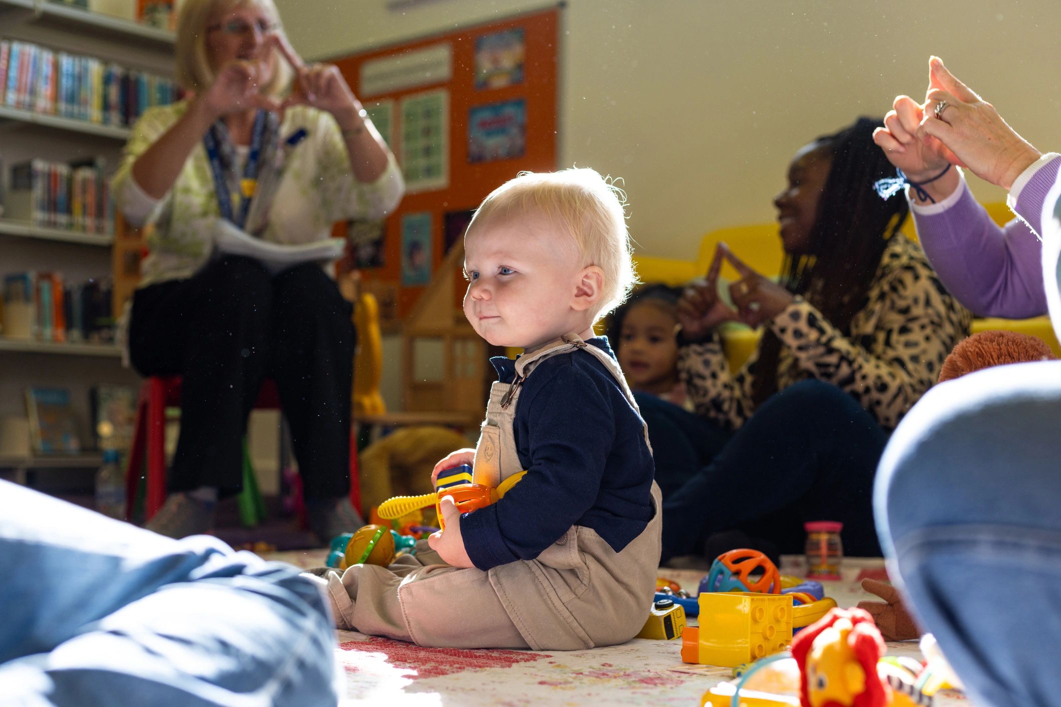 Young child playing with educational toys on the floor