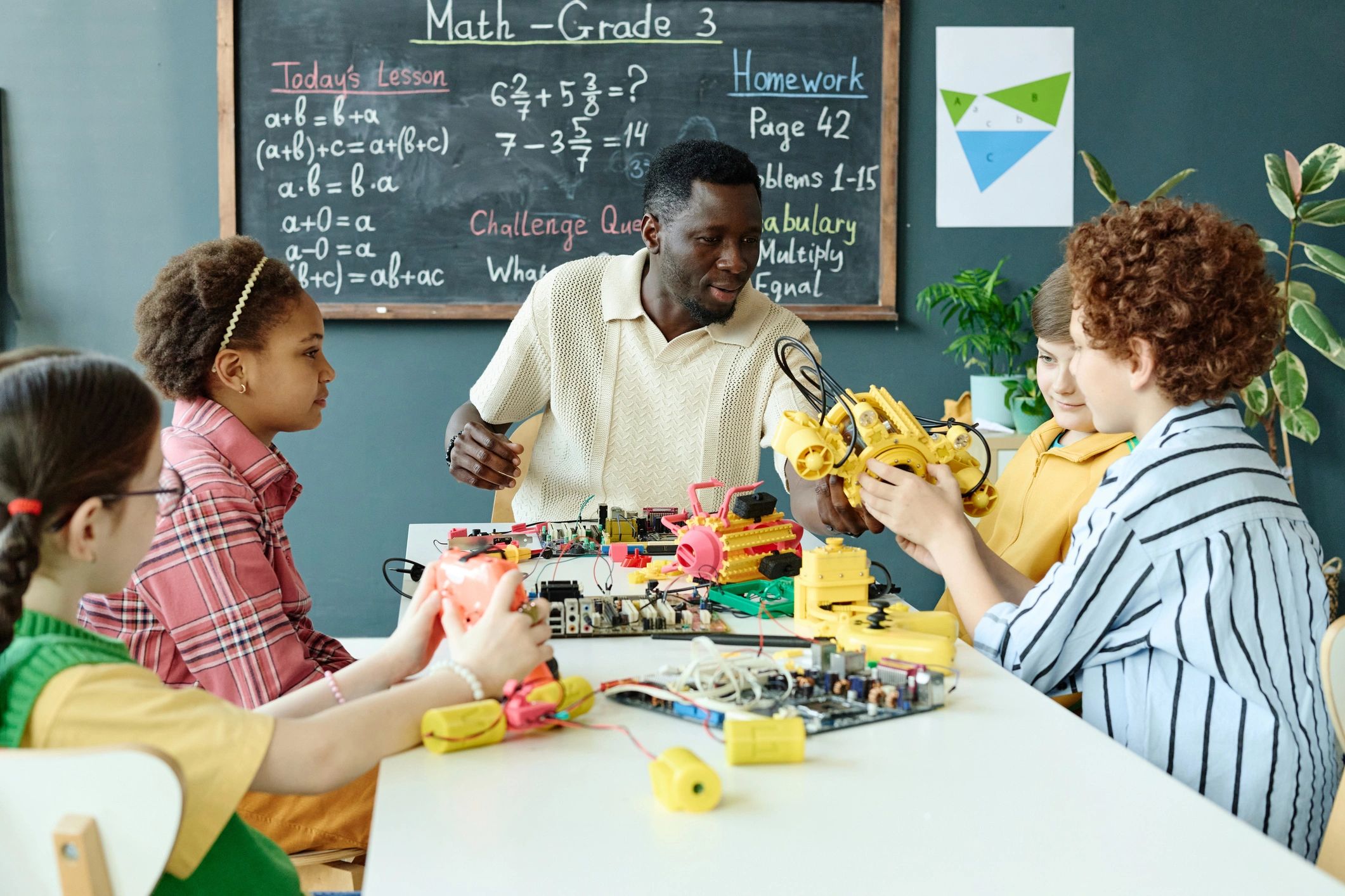 Children enjoying hands-on STEM play together in a classroom
